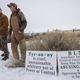Members of an armed anti-government militia monitor the entrance to the Malheur National Wildlife Refuge headquarters near Burns, Ore., Jan. 5, 2016.
ROB KERR/AFP/Getty Images